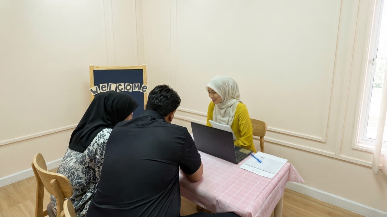 Parents meeting an AMP Preschool teacher during admissions