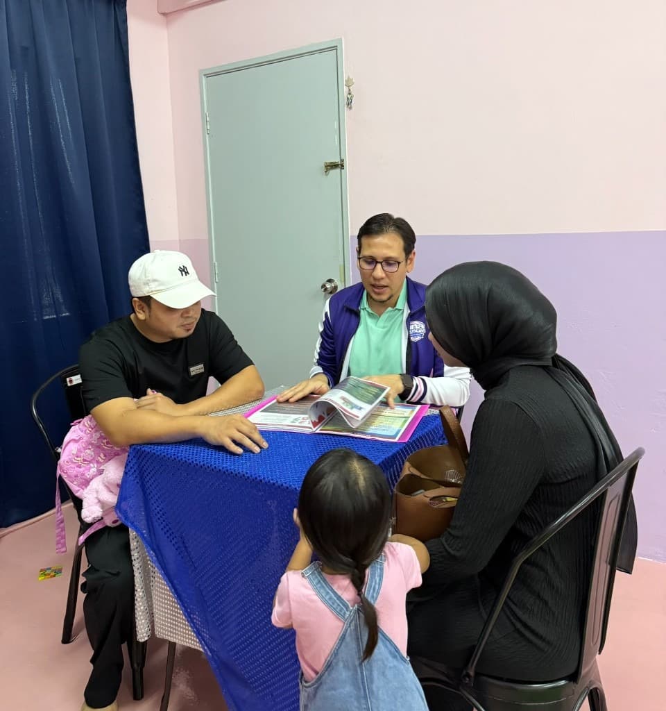 AMP Preschool staff meeting with a family